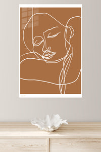 Terracotta Contour Face metal wall art displayed in a modern interior