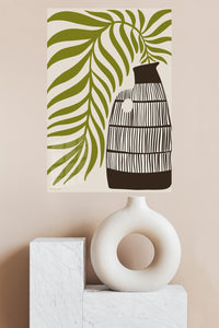 Olive Leaves and Striped Vase metal wall art displayed in a modern interior