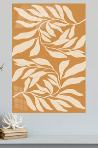 Cream Leaf Silhouettes on Ochre metal wall art displayed in a modern interior