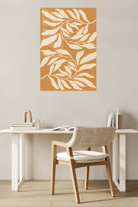 Cream Leaf Silhouettes on Ochre metal wall art displayed in a contemporary living space