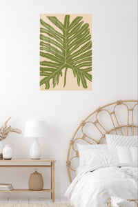 Olive Tropical Leaf Silhouette metal wall art displayed in a contemporary living space