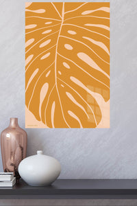 Ochre Monstera Leaf metal wall art displayed in a modern interior