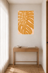 Ochre Monstera Leaf metal wall art displayed in a contemporary living space