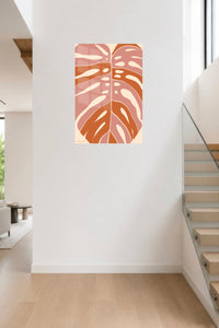 Terracotta Monstera Leaf metal wall art displayed in a contemporary living space