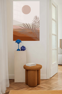 Terracotta Sun and Palm Fronds metal wall art displayed in a contemporary living space