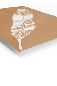 White Feather on Terracotta premium metal wall art – angled view