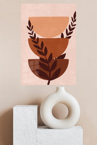 Terracotta Botanical Balance metal wall art displayed in a modern interior