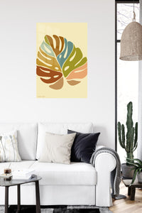 Earth Tone Monstera Leaves metal wall art displayed in a contemporary living space