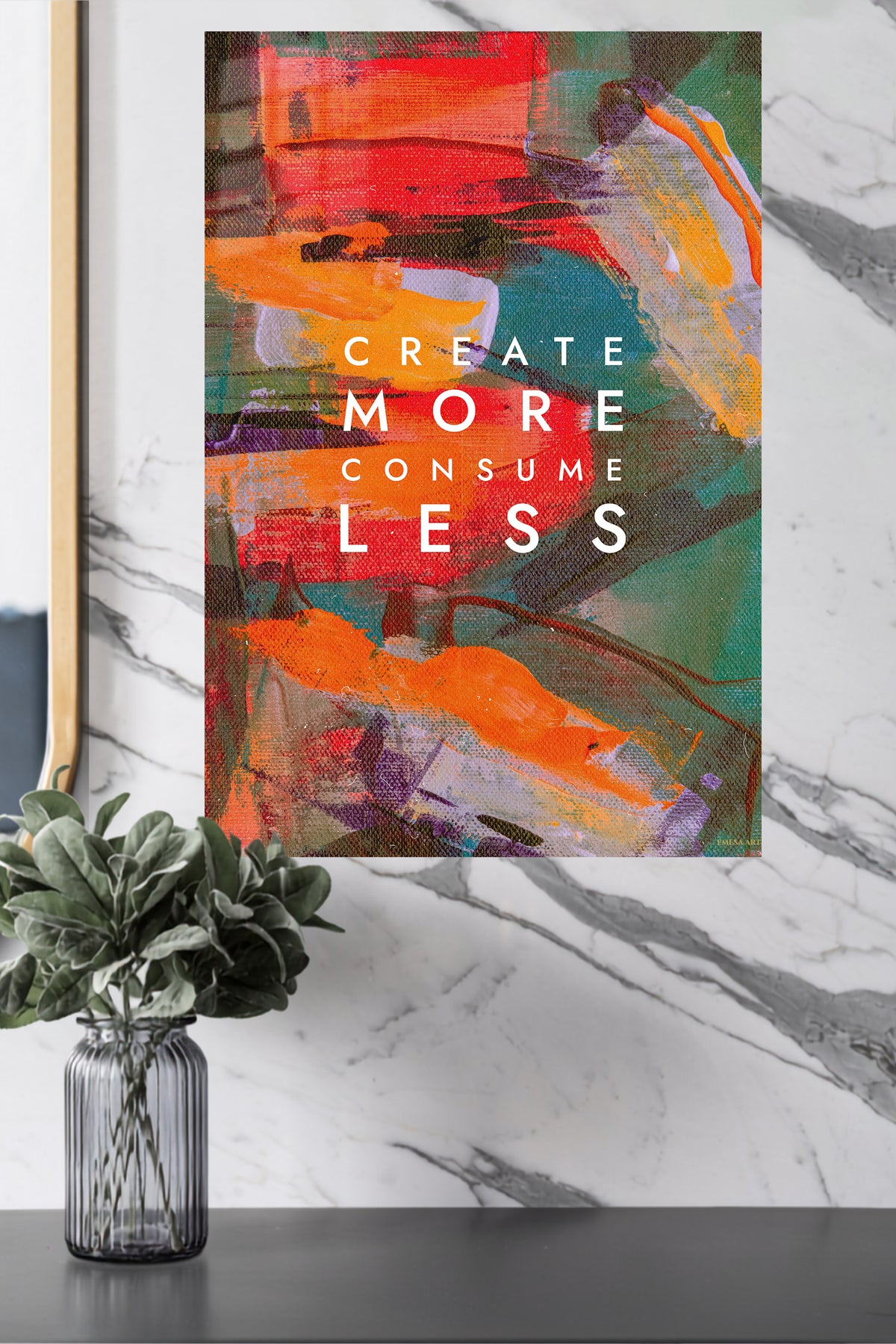 Create More Consume Less metal wall art displayed in a modern interior