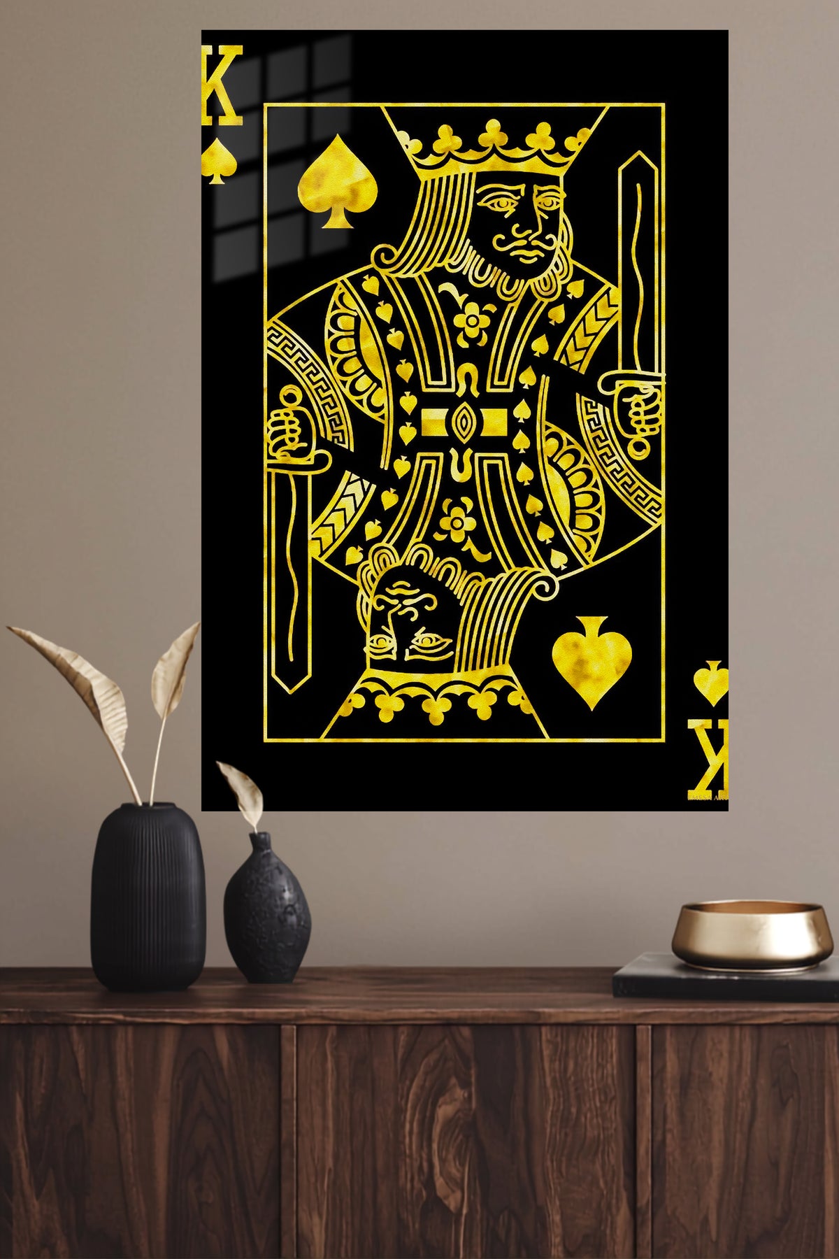 Golden King of Spades metal wall art displayed in a modern interior