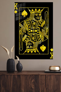 Golden King of Spades metal wall art displayed in a modern interior