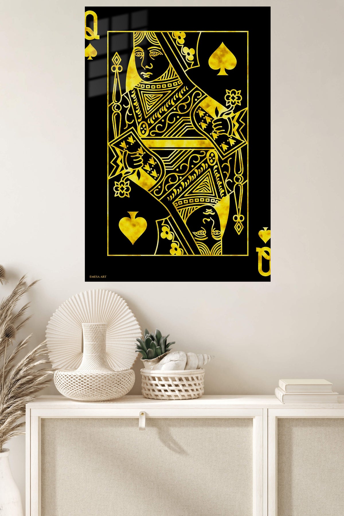 Golden Queen of Spades metal wall art displayed in a modern interior