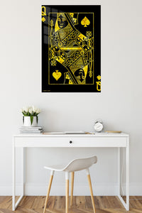 Golden Queen of Spades metal wall art displayed in a contemporary living space